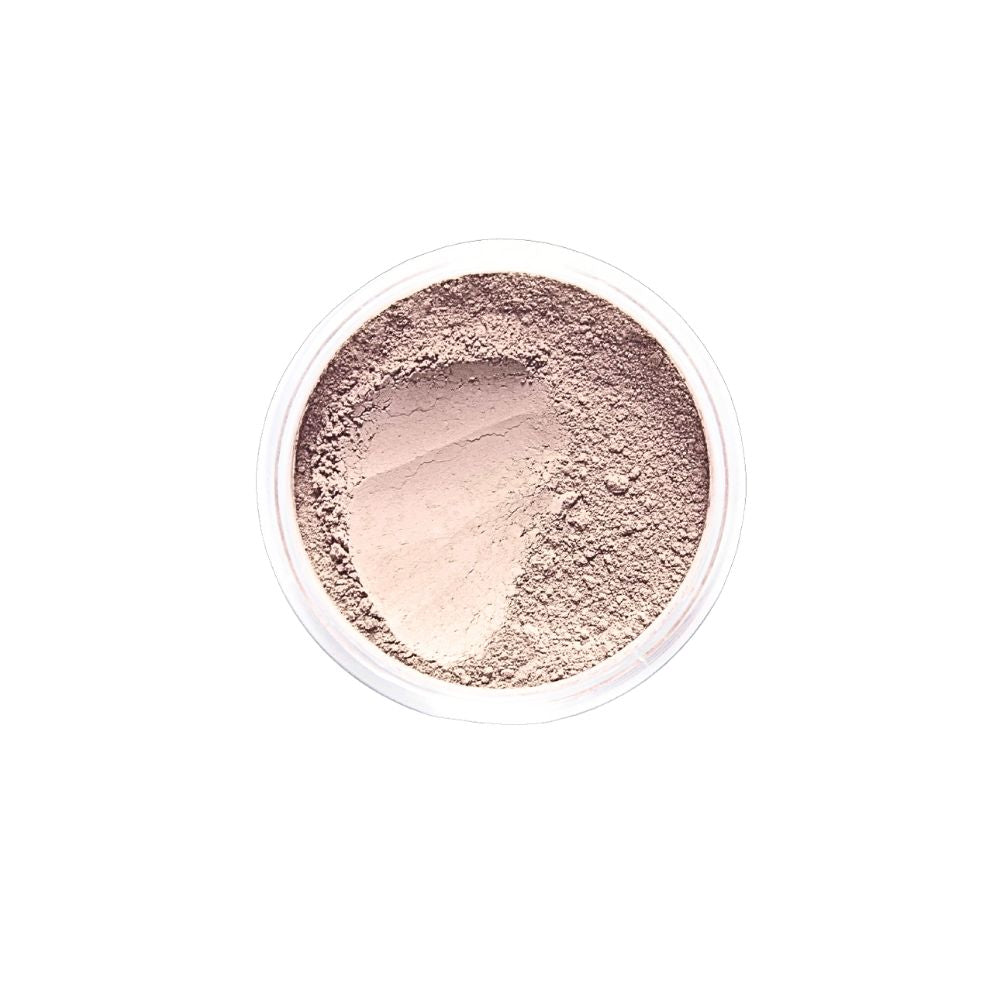 Top-down view of Dr. Berrettini's Mendocino Minerals 'Sheerly Flawless Foundation - Sunkissed' in a round container, featuring a beige or neutral undertone with a distinct indentation, complements light tan skin.